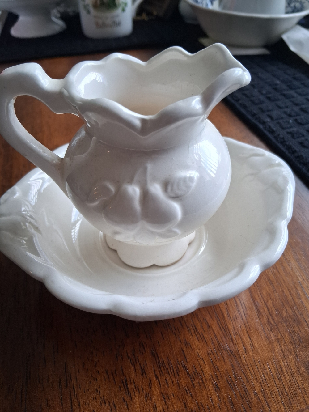 White Ceramic Decorative Creamer and Saucer Set